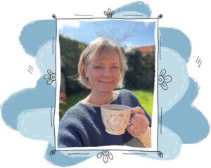 Lucy Ormsby holding a handmade cuppa