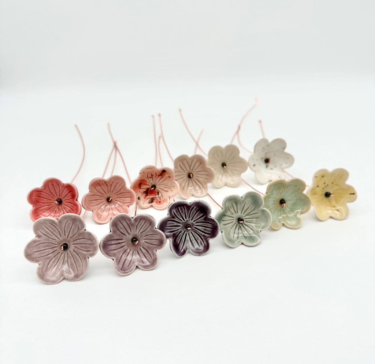 Everlasting ceramic flowers available in 12 shades handmade by Lucy Ormsby