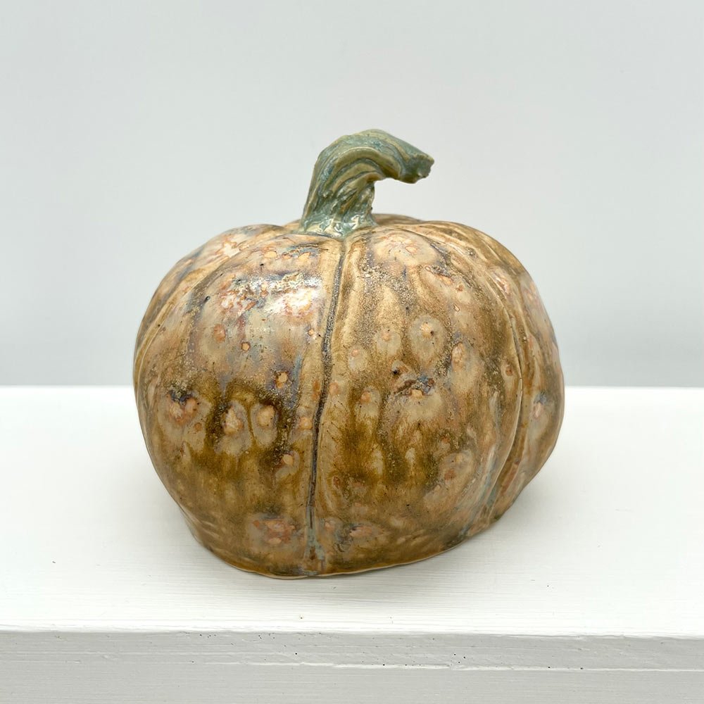 Carved ceramic pumpkin in white by Lucy Ormsby Pottery - from the back