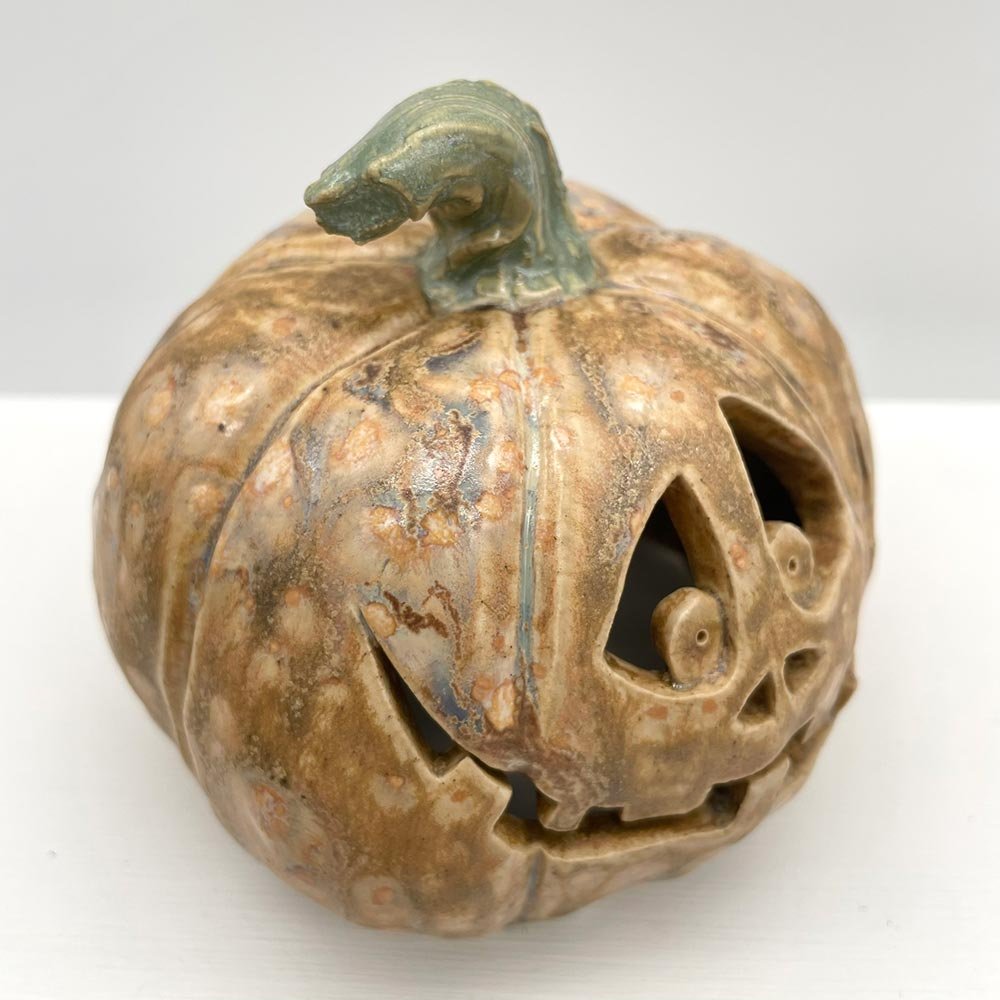 Carved ceramic pumpkin in white by Lucy Ormsby Pottery - close-up