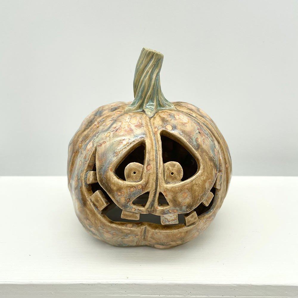 Carved ceramic pumpkin by Lucy Ormsby Pottery - from the front