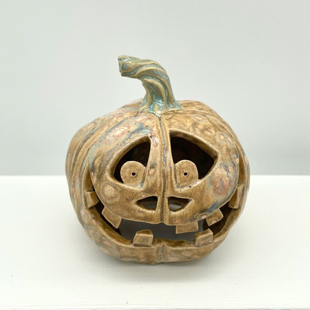 Carved ceramic pumpkin by Lucy Ormsby Pottery - from the front