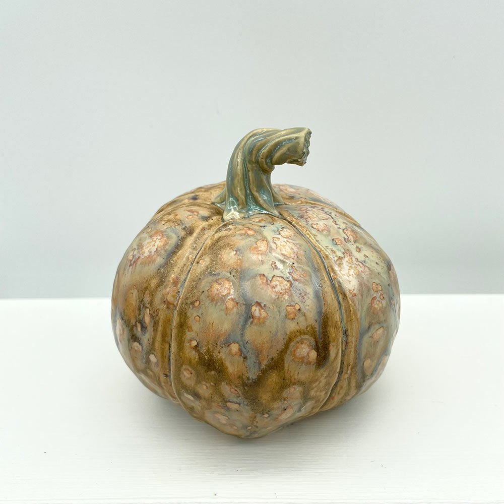 Carved ceramic pumpkin by Lucy Ormsby Pottery - from the back
