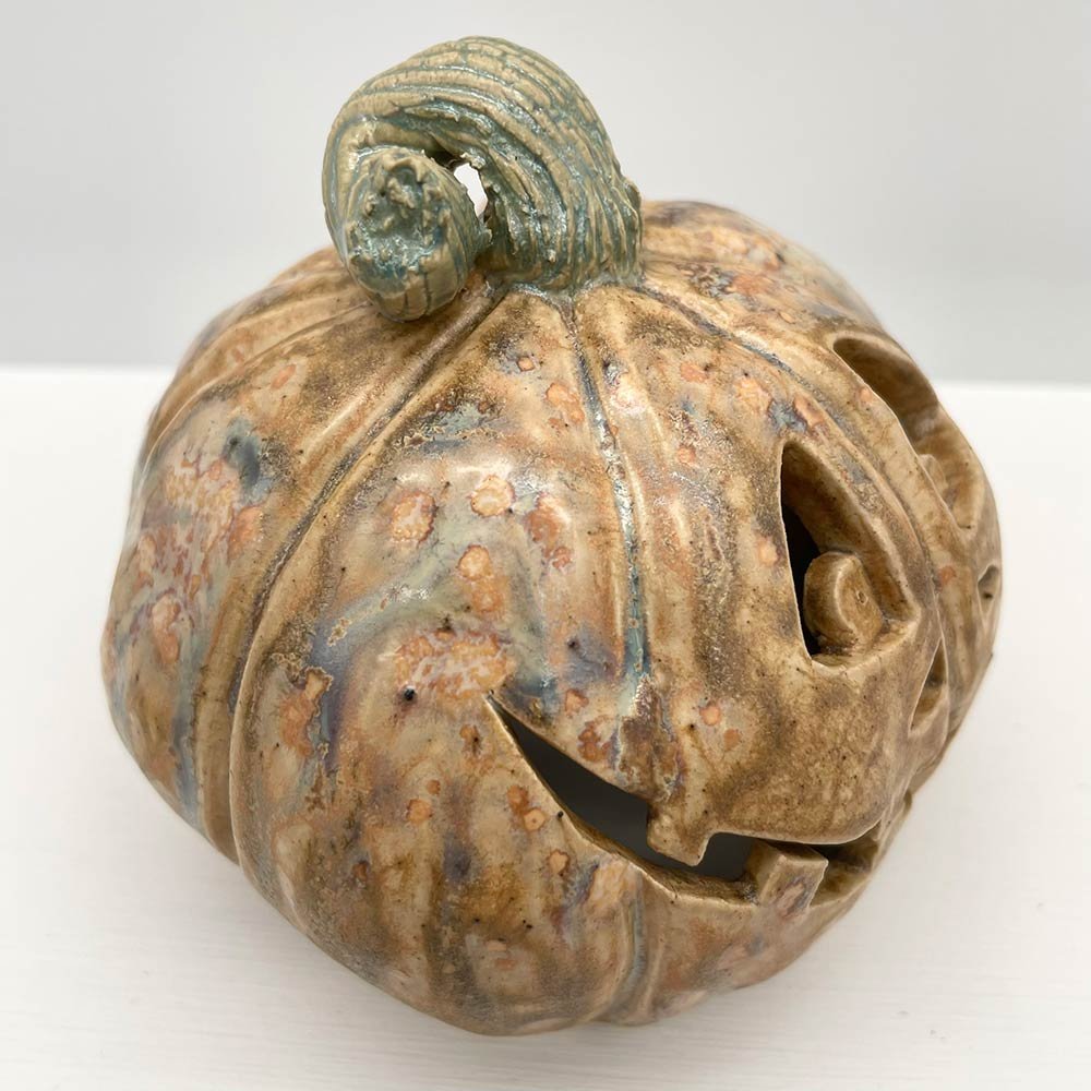 Carved ceramic pumpkin in white by Lucy Ormsby Pottery - close-up
