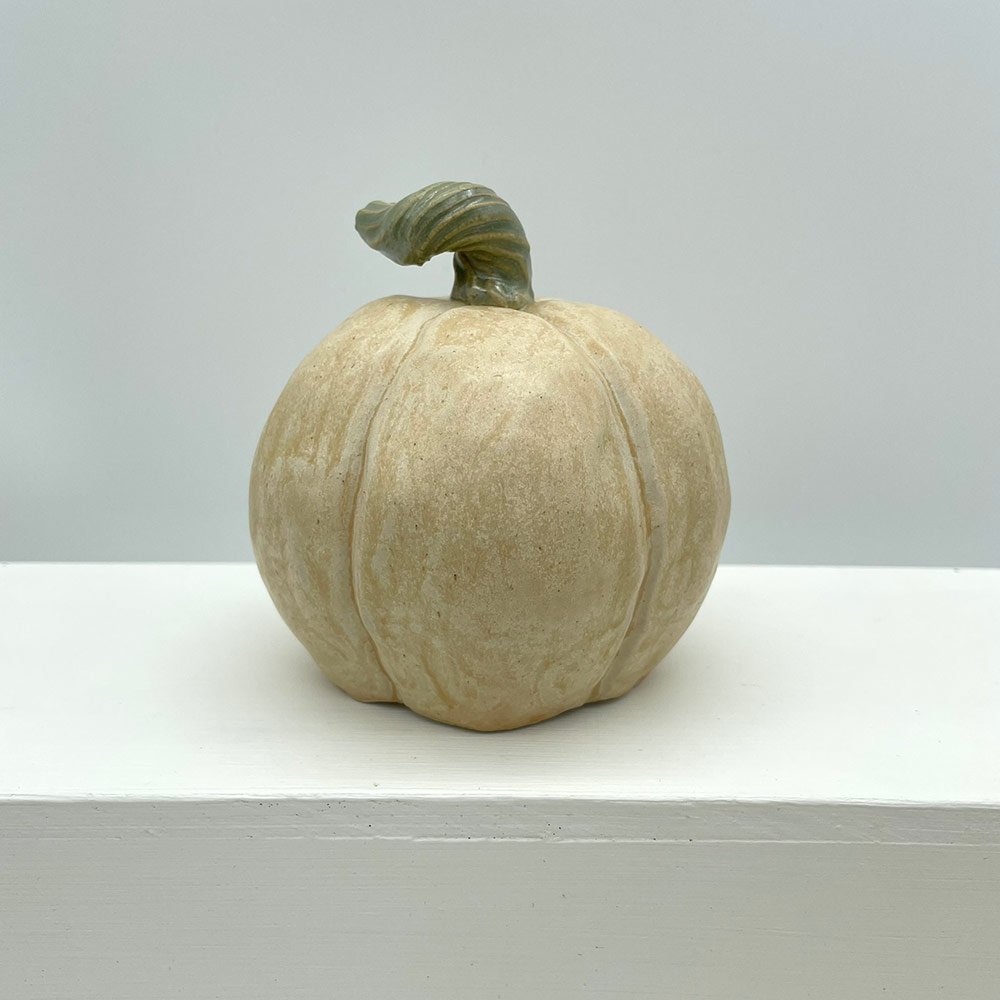 Carved ceramic pumpkin in white by Lucy Ormsby Pottery - from the back
