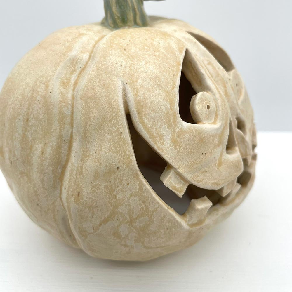 Carved ceramic pumpkin in white by Lucy Ormsby Pottery - close-up