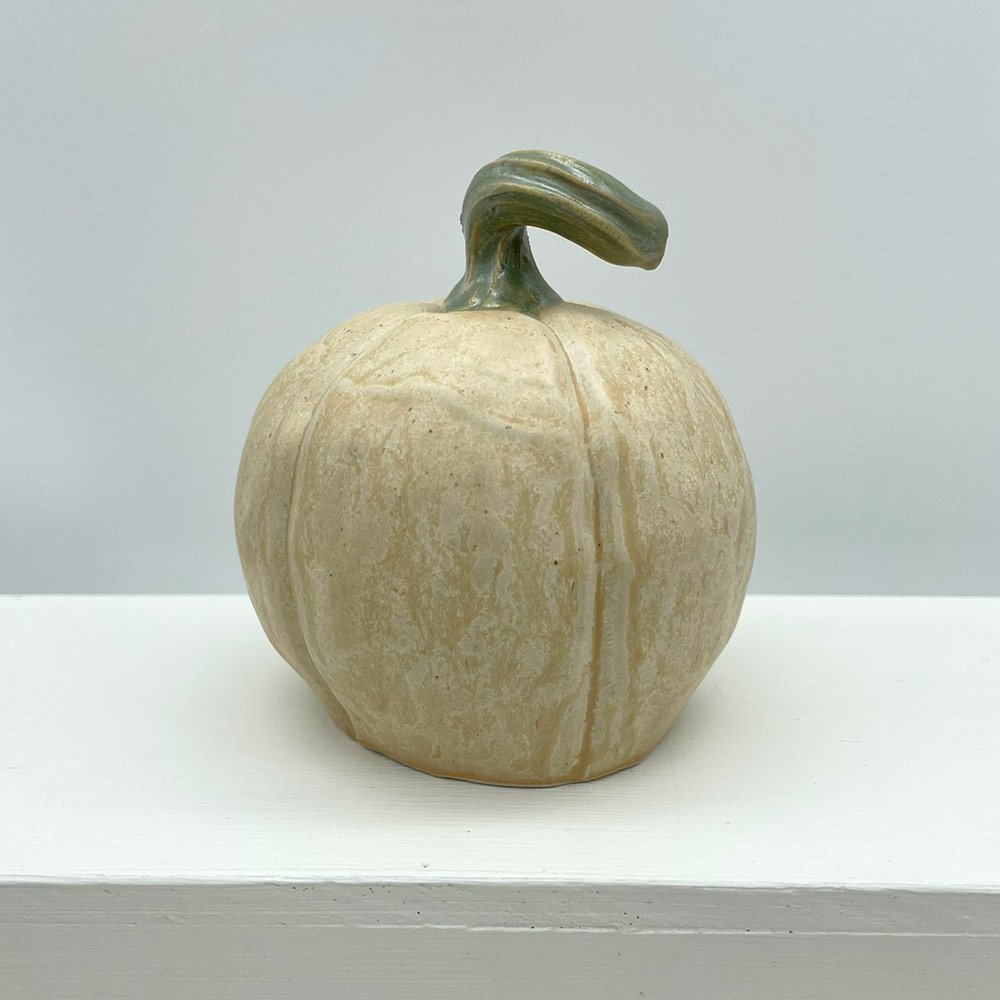 Carved ceramic pumpkin in white by Lucy Ormsby Pottery - from the back