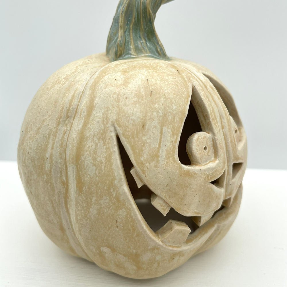 Carved ceramic pumpkin in white by Lucy Ormsby Pottery - close-up