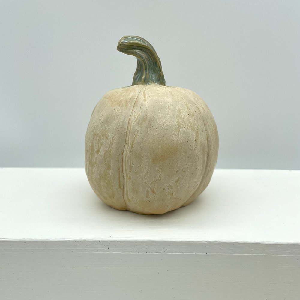 Carved ceramic pumpkin in white by Lucy Ormsby Pottery - from the back