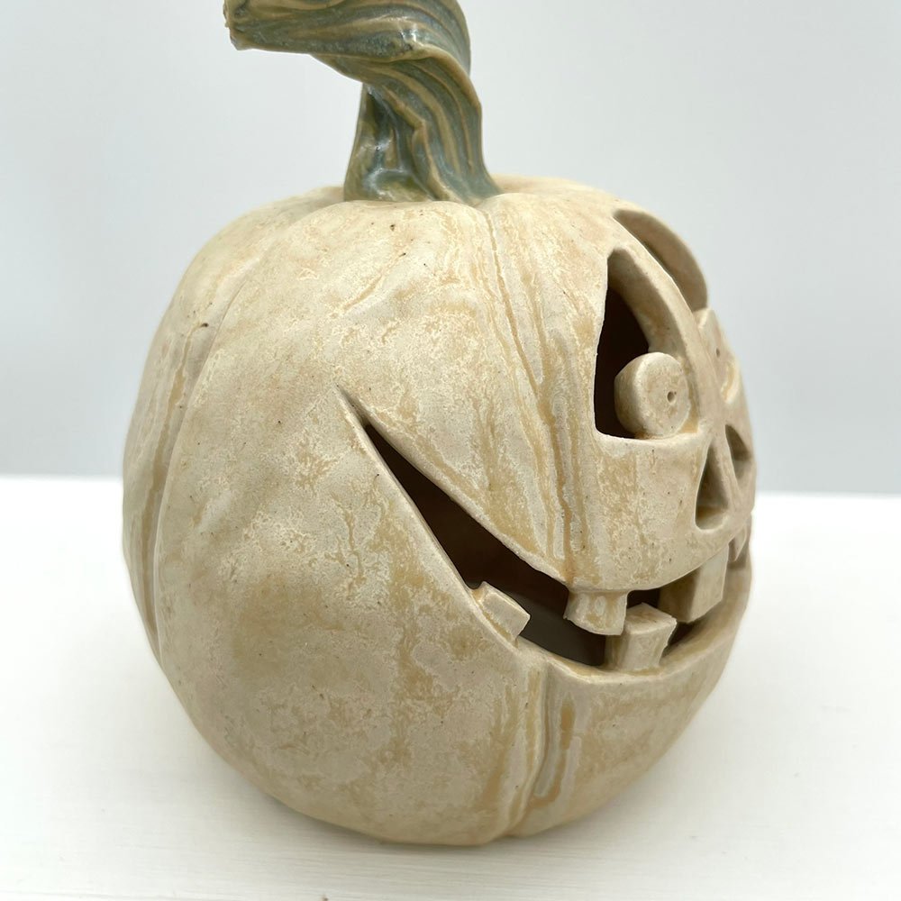 Carved ceramic pumpkin from Lucy Ormsby Pottery from the side