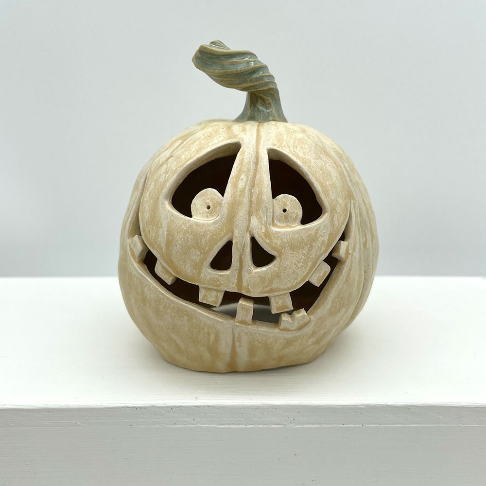Carved ceramic pumpkin by Lucy Ormsby Pottery -from the front