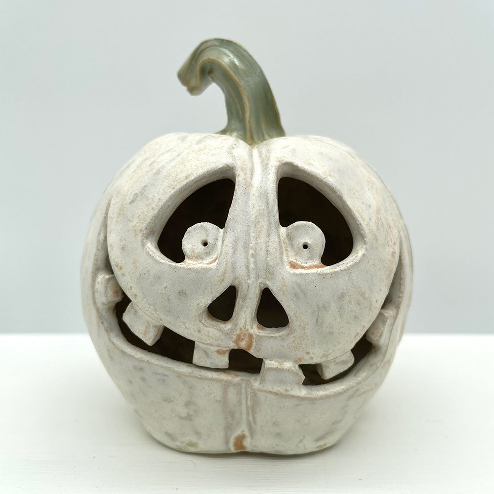Carved ceramic pumpkin in white by Lucy Ormsby Pottery - close-up