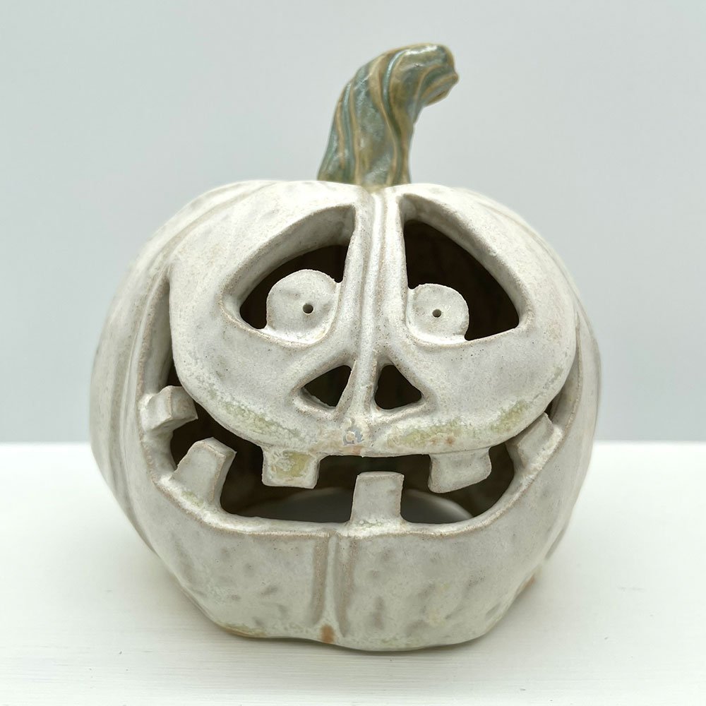 Carved ceramic pumpkin in white by Lucy Ormsby Pottery - close-up