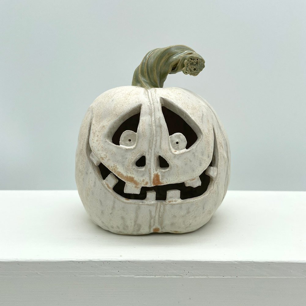 Carved ceramic pumpkin by Lucy Ormsby Pottery -from the front