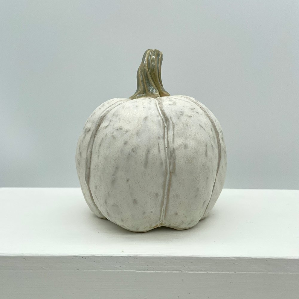 Carved ceramic pumpkin in white by Lucy Ormsby Pottery - from the back