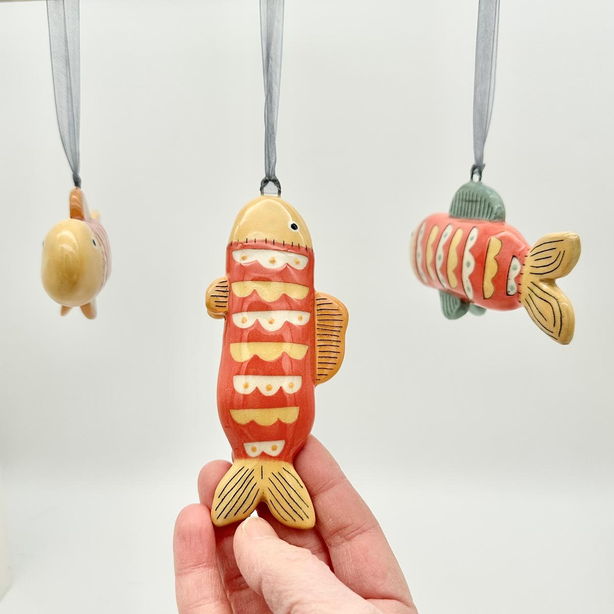Lucy Ormby Pottery ceramic fish hanging decoration red yellow scales