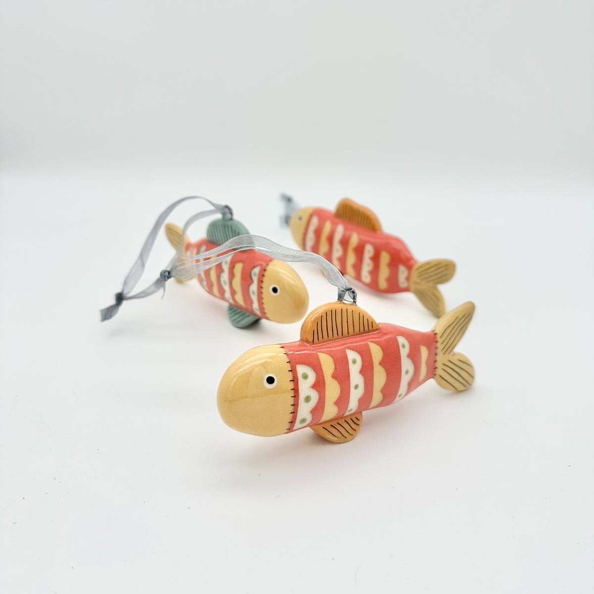 Lucy Ormby Pottery ceramic fish hanging decoration red yellow scales