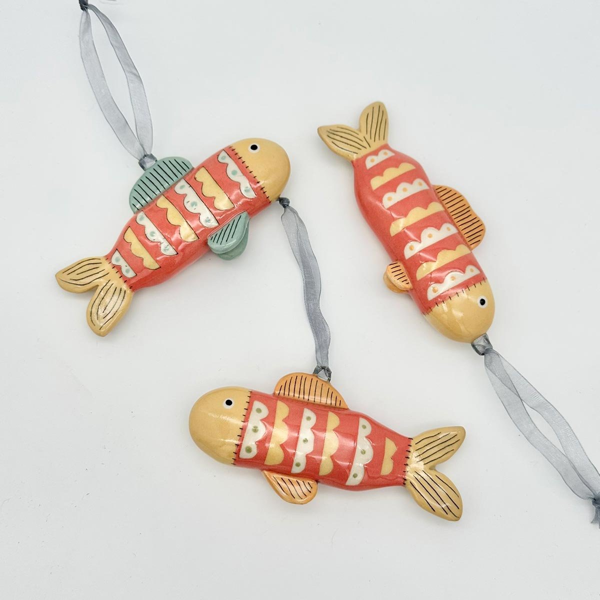 Lucy Ormby Pottery ceramic fish hanging decoration red yellow scales