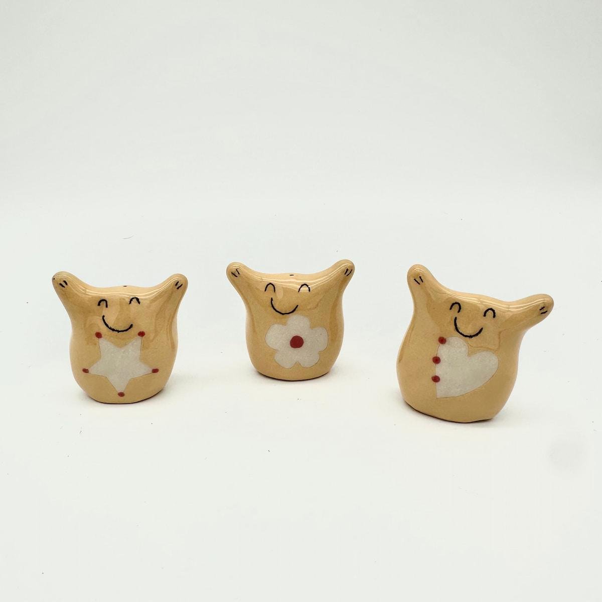 Trio of yellow Hug Nuggets
