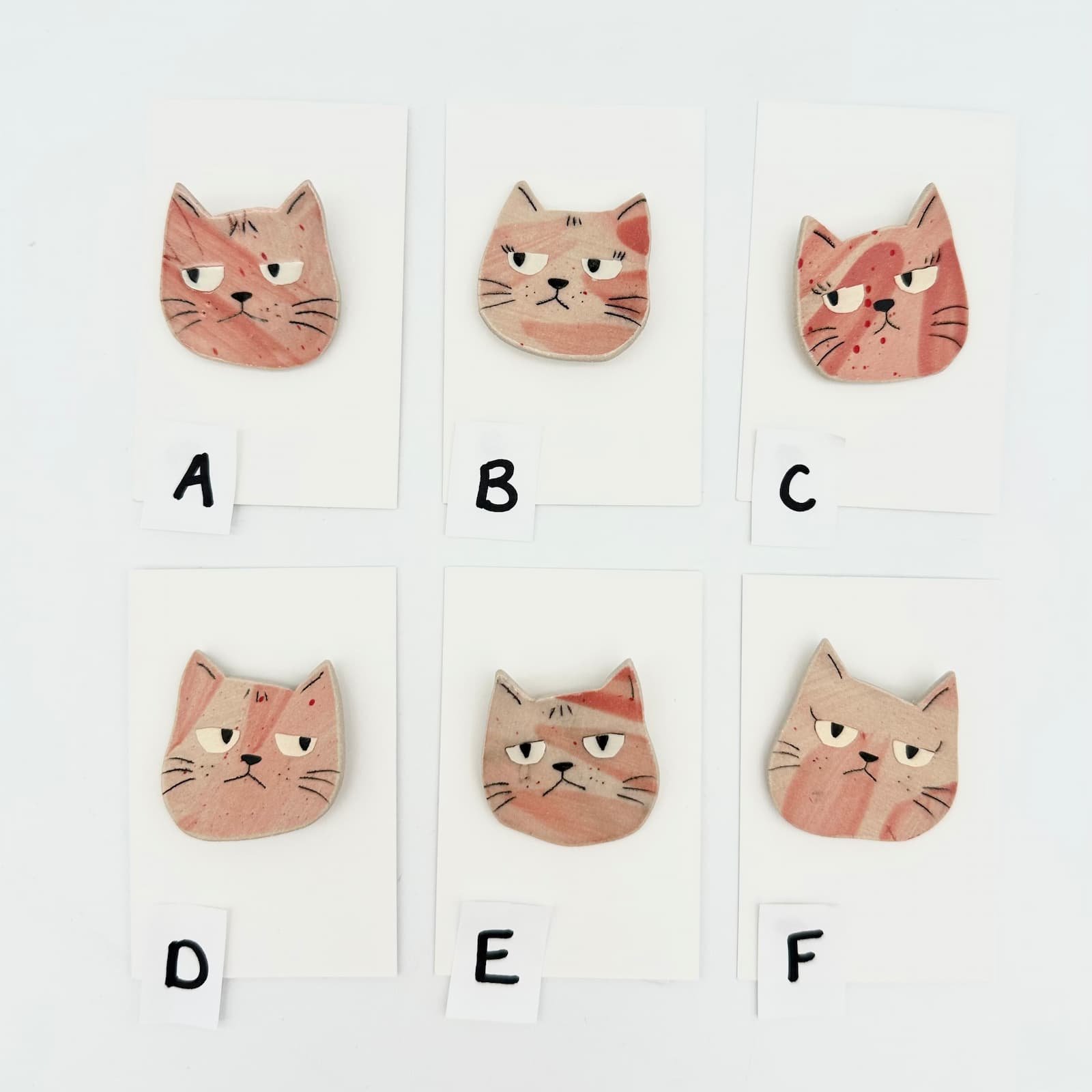 Pink cat brooch - ceramic cat head - group