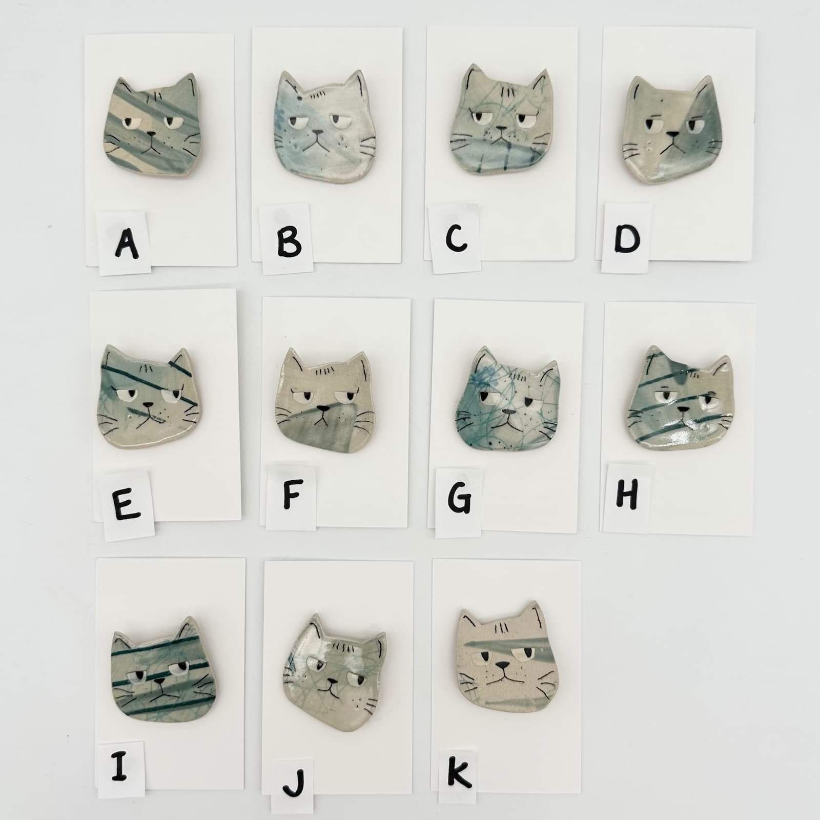 Blue cat brooch - group