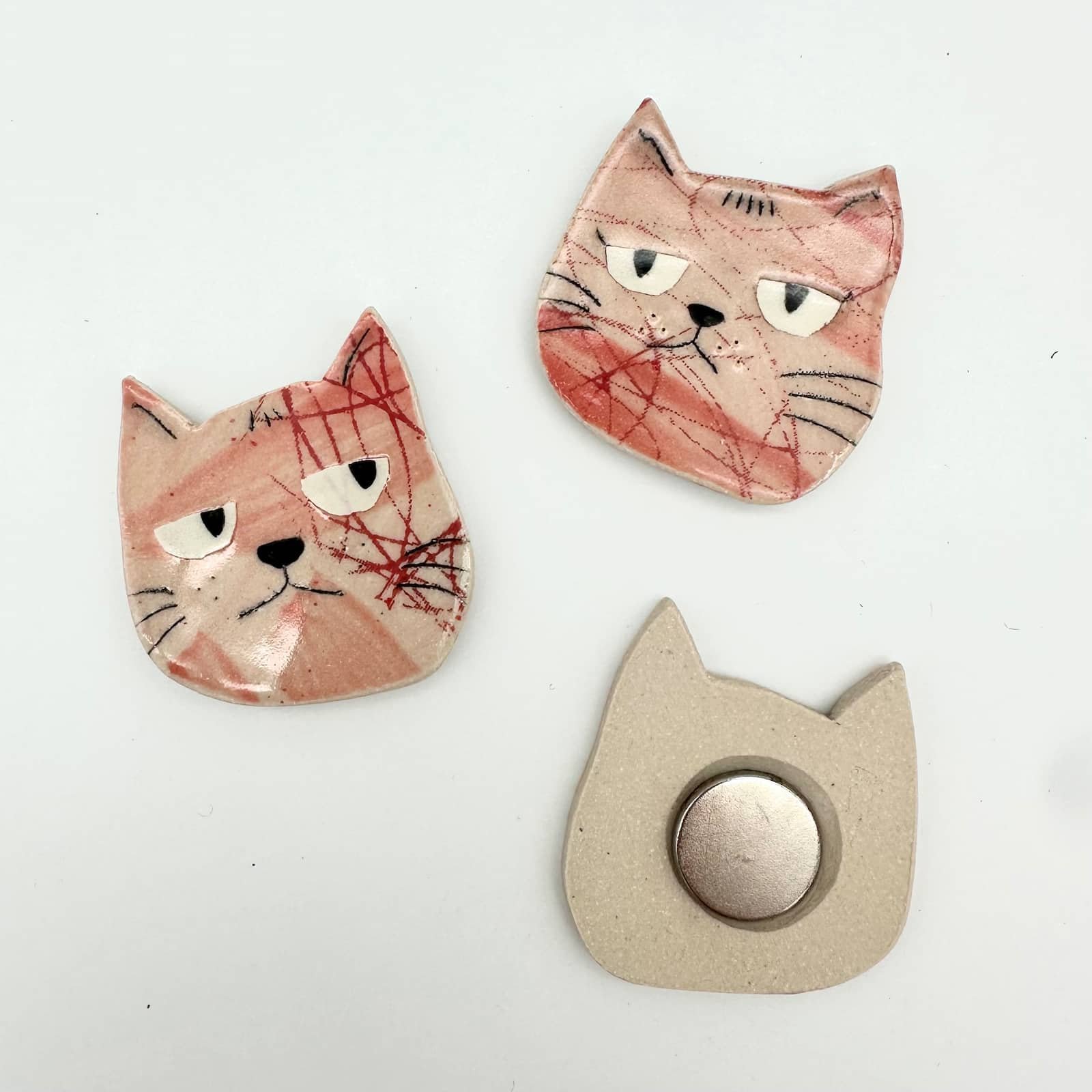 Pink cat magnet group